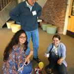 students performing experiment with a balloon